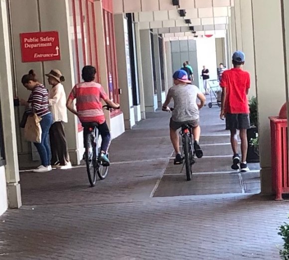 Bicycle safety...? What bicycle safety? Bicycle riders on the sidewalk in front of PSD offices.